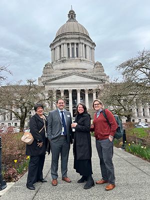 Five State Board staff members standing in front of the Legislative Building