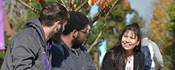 three students in quad